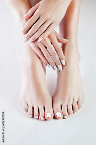 female legs with manicure