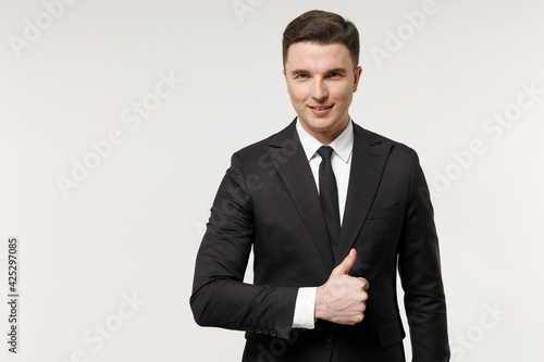 Young caucasian successful employee business corporate lawyer man in classic formal black grey suit shirt tie work in office show thumb up like gesture isolated on white background studio portrait