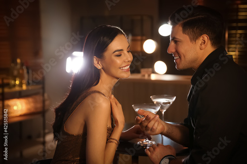 Man and woman flirting with each other in bar