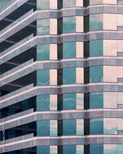 Geometric architectural abstract of reflective windows of a contemporary office building