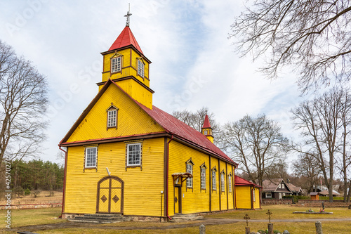 Yellow old wooden Šilėnai church built in 1725 in a village in Neris Regional Park near Vilnius, Lithuania 