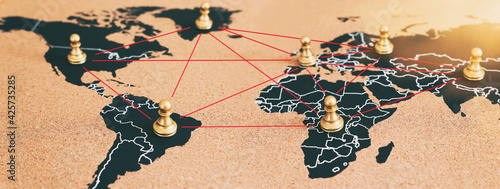 concept of geopolitics or worldwide economy. chess figures placed on map banner