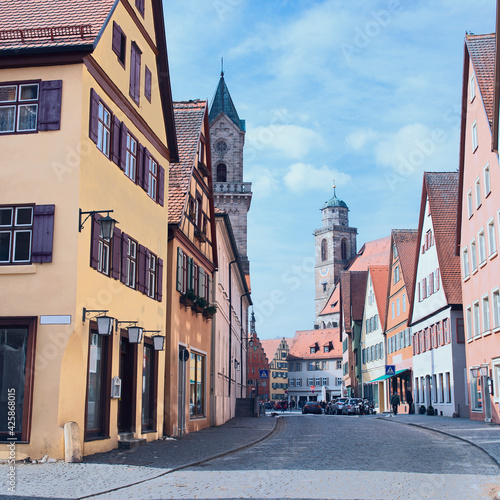 beautiful colored houses and stately cathedrals along an old cobbled street in the small German town of Harburg