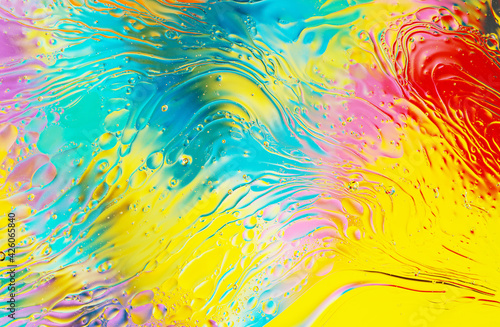 oil drops on water with vivid colorful background