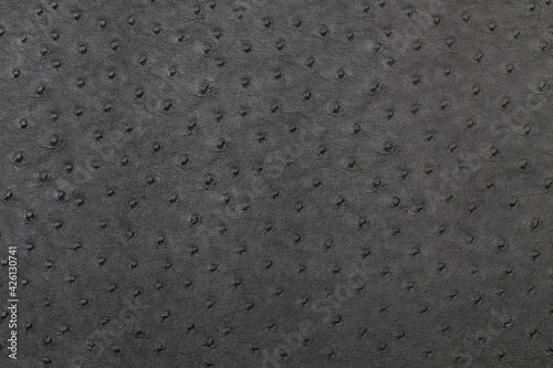 Fondo textura de cuero negro con puntos y una superficie irregular con relieve