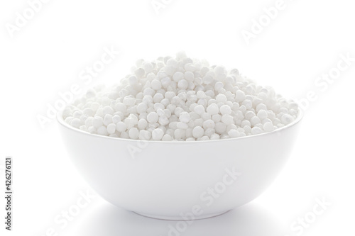 Close up of organic white sago or sabudana big size inside a white ceramic bowl