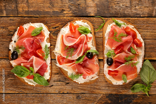 sandwich- bread slice with cream cheese and prosciutto ham
