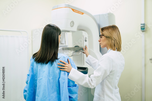 Young woman is having mammography examination at the hospital or private clinic with a professional female doctor.