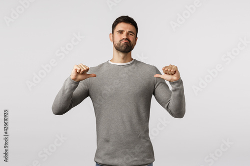 I can handle it. Macho man serious-looking confident bearded guy, pointing himself with proud, assertive and self-assured expression, smirk and looking camera determined, propose own help, bragging