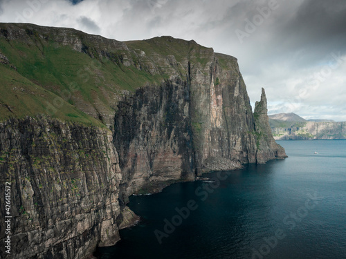 Rock formation Trøllkonufingur with steep cliffs on Vagar Island, Faroe Islands.