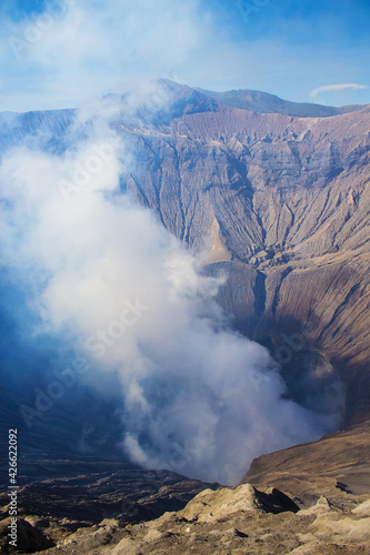 Crater with active volcano smoke and sulfur, view from the observation deck of erupting and active Bromo volcano. Bromo Tengger Semeru National Park, East Java, Indonesia.