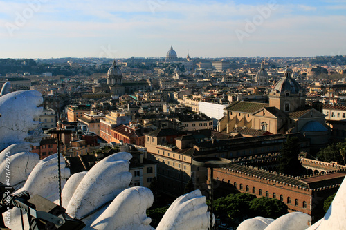 Vatican's St. Peter Basilica at skyline with city view of Rome from the rooftop of Vittorio Emmanuelle II Monument.