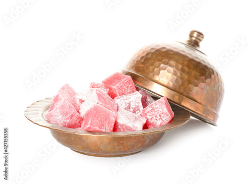 Plate with Turkish delight on white background