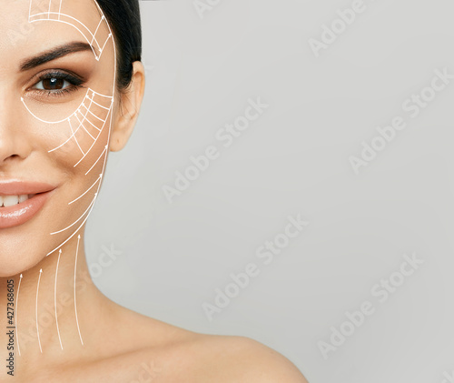 Lifting skin. Lifting lines on half of a woman's face, advertising of face contour correction, skin and neck lifting. Facial rejuvenation concept