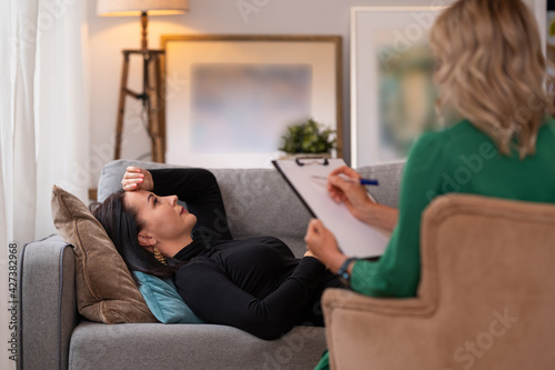 Woman lying in couch during therapy session