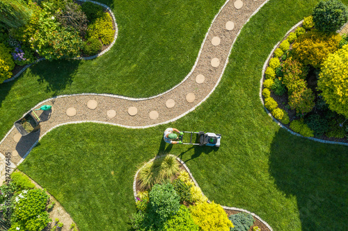 Big Garden Grass Field Mowing by Caucasian Gardener