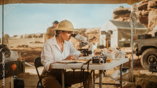 Archeological Digging Site: Great Female Archaeologist Doing Cultural Research, Discovers Ancient Civilization Historical Artifacts, Fossil Remains at Excavation Site, Study it Under Microscope