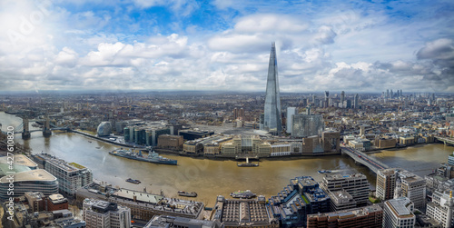 Elevated, panoramic view of the modern skyline of London, United Kingdom, from the Tower Bridge to London Bridge on a sunny day