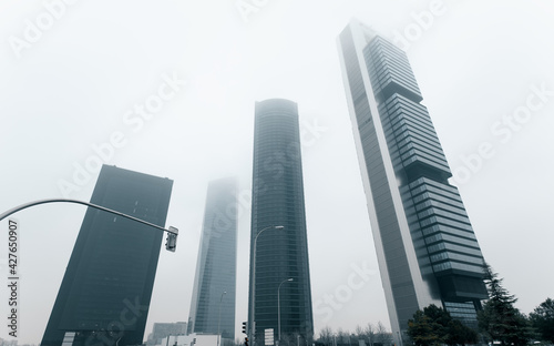 Four Towers Business Area against misty sky. Madrid, Spain