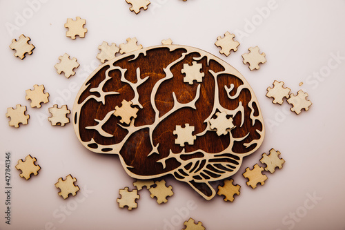 Brain with wooden puzzles. Mental Health and problems with memory