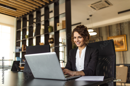 Beautiful positive executive at work, portrait.