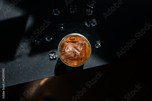 Close-up glass of iced coffee with milk on the table