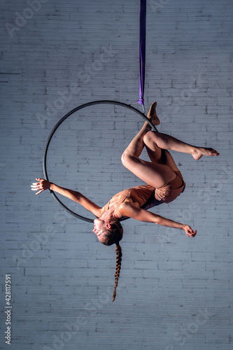 A Young Acrobat Woman Working on a Hoop