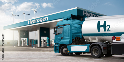 Truck with hydrogen fuel tank trailer on a background of H2 filling station. Concept