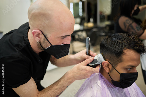 barber wearing mask shave man with razor