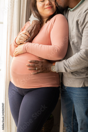 Happy moment expecting a baby of a multiracial couple