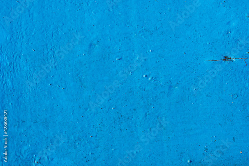 Background texture. Dusty old wooden surface painted with blue paint. Top view. Copy space
