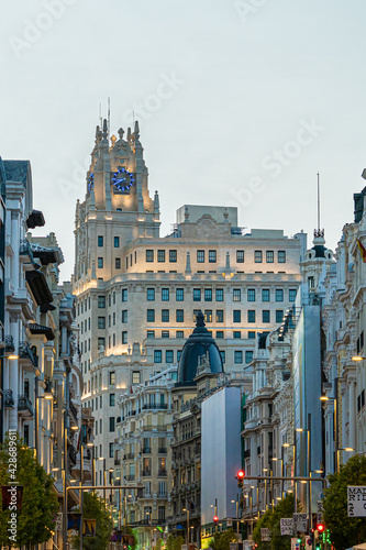 Photographs of the Telefónica building on Gran Vía street in Madrid in Spain during sunset