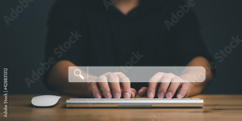 Data Search Technology Search Engine Optimization. man's hands are using a computer keyboard to Searching for information. Using Search Console with your website.