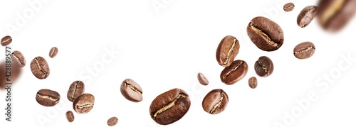 Dark aromatic roasts beans coffee levitate on white background with copyspace.
