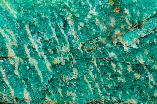 Abstract background. Rough surface of natural amazonite