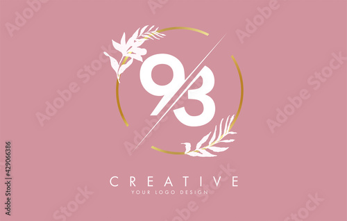 Number 93 9 3 logo design with golden circle and white leaves on branches around.