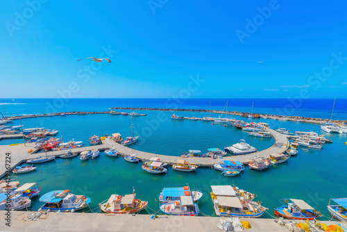 Greece Santorini island in Cyclades, Ammoudi village with fishing boats