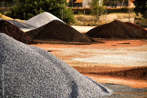 Colorful construction aggregate mountains in Spain