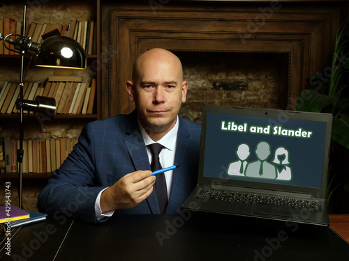 Conceptual photo about Libel and Slander with written text on the laptop.