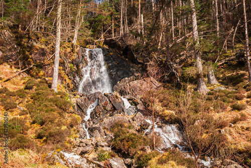 A 3 shot HDR image of a burn tumbling down through a Kintail Forest, near the location of the 1719 battle of Glen Shiel, Scotland