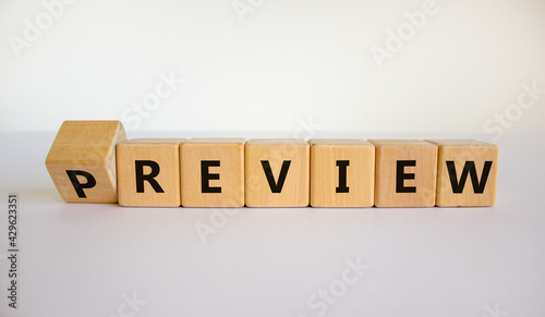 Preview or review symbol. Turned the cube and changed the word 'preview' to 'review'. Beautiful white background, copy space. Business, preview or review concept.