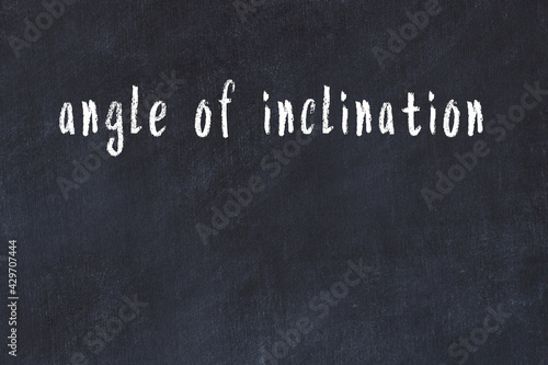 College chalk desk with the word angle of inclination written on in