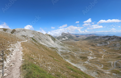 wide valley in the Italian Abruzzi region of the Gran Sasso massif in central Italy in summer