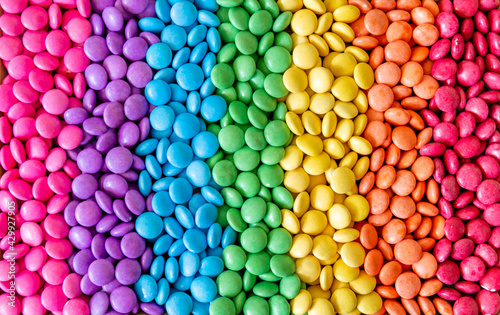 Vibrant sweet rainbow made of multi-colored round candies