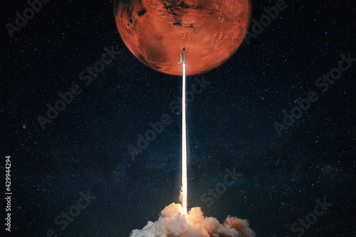 Rocket with blast and smoke takes off to the red planet mars mars, concept. Spacecraft lift off to explore other planets. Rocket launch