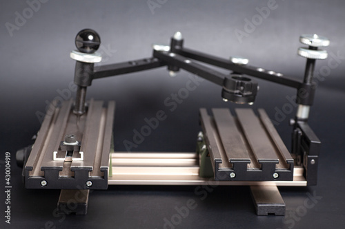 Engraving device pantograph on black background