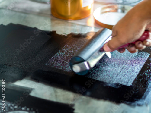 Printmaking tool in art studio.