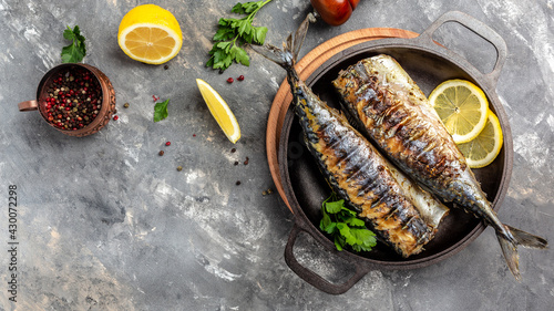 Grilled mackerel fish with lemon herbs and spices, banner, menu recipe place for text, top view