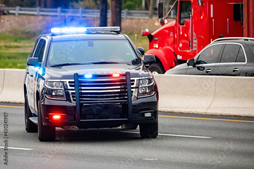 Road patrol police car on highway scene with emergency lights