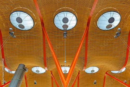 The beautiful architecture of Barajas airport in Madrid with its modern roof and wooden panels, Spain, Europe.